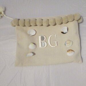 BG pom pom shell bag w/shells and zippered. Funky & cute make up accessory bag